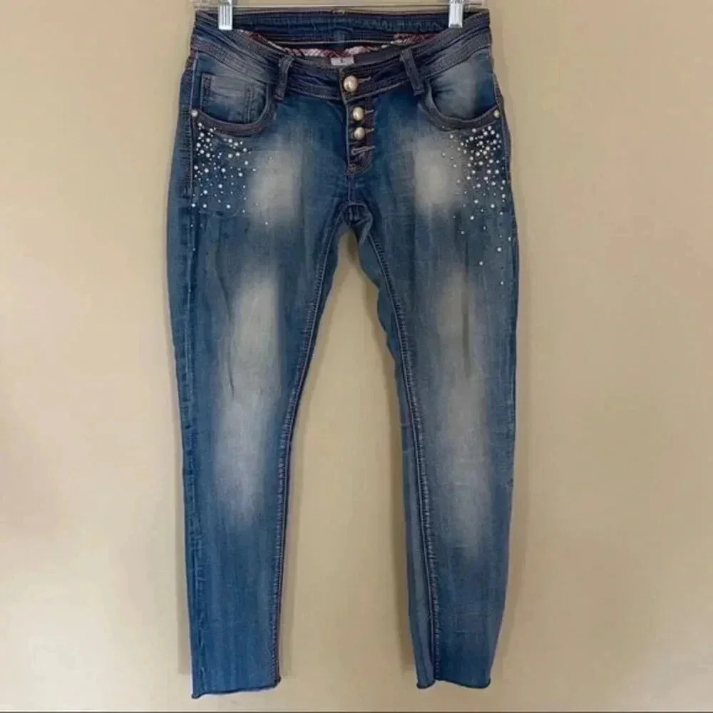 - Women jeans with gold embellishments